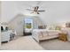 Bright bedroom with a desk, comfortable bed, and a view of the outdoors through the window at 282 Brodie Rose Landing Way, Smithfield, NC 27577