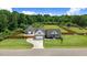Beautiful single-story home features attached garage and large, fenced yard with mature trees and landscaping at 282 Brodie Rose Landing Way, Smithfield, NC 27577