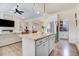 Open-concept kitchen with an island, granite counters, stainless appliances, and seamless flow to the living area at 282 Brodie Rose Landing Way, Smithfield, NC 27577