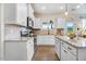 Modern kitchen featuring granite countertops, stainless steel appliances, ample cabinet space and wood floors at 282 Brodie Rose Landing Way, Smithfield, NC 27577
