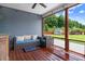Spacious covered porch has backyard views with outdoor furniture, ideal for relaxing at 282 Brodie Rose Landing Way, Smithfield, NC 27577