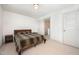 Bedroom features neutral carpet, white walls, and two doors leading to additional spaces at 283 Daniel Ridge Rd, Wendell, NC 27591