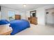 Bedroom features a wood dresser, neutral carpeting, and natural light from two windows at 283 Daniel Ridge Rd, Wendell, NC 27591