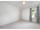Bright bedroom with white walls and gray trim, a window, and neutral carpet at 283 Daniel Ridge Rd, Wendell, NC 27591