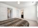 Bright bedroom with white walls, gray trim, and doors leading to other rooms at 283 Daniel Ridge Rd, Wendell, NC 27591