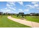 Beautiful community park with walking trails, art installations, and plenty of green space for outdoor activities at 283 Daniel Ridge Rd, Wendell, NC 27591