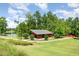 Community pavilion and grassy spaces with walking trails and a peaceful pond for a relaxing day in the park at 283 Daniel Ridge Rd, Wendell, NC 27591