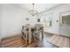 Dining area features light wood table, bench seating, and a modern chandelier at 283 Daniel Ridge Rd, Wendell, NC 27591