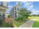 Two-story home with well-kept landscaping, a sidewalk, and a partial view of a playground at 283 Daniel Ridge Rd, Wendell, NC 27591
