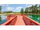 Scenic pond deck with vibrant turquoise water, offering a peaceful spot to enjoy nature and the community views at 283 Daniel Ridge Rd, Wendell, NC 27591