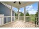 Screened porch with views of the trees and neighborhood, featuring a wooden deck at 283 Daniel Ridge Rd, Wendell, NC 27591