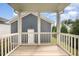 View of the exterior from screened in porch with views of the blue siding on the house at 283 Daniel Ridge Rd, Wendell, NC 27591