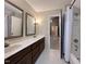 Bathroom has a dual-sink vanity, a tub, and a shower, blending functionality with a touch of sophistication at 2900 Sylvania Dr, Raleigh, NC 27607
