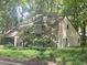 Charming home surrounded by lush greenery and towering trees, creating a serene and private atmosphere at 2900 Sylvania Dr, Raleigh, NC 27607