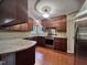 Well-equipped kitchen featuring stainless steel appliances, granite countertops, and wood cabinets at 2900 Sylvania Dr, Raleigh, NC 27607