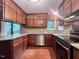 Functional kitchen featuring wood cabinets, stainless steel appliances, and granite countertops at 2900 Sylvania Dr, Raleigh, NC 27607