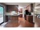 Open kitchen concept showcases wood cabinets, granite countertops, and access to the deck at 2900 Sylvania Dr, Raleigh, NC 27607