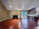 Inviting living room boasts a brick fireplace and a seamless flow into the adjacent kitchen area at 2900 Sylvania Dr, Raleigh, NC 27607