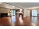 Spacious living room featuring a fireplace, hardwood floors, and sliding door access to deck at 2900 Sylvania Dr, Raleigh, NC 27607