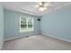 Bedroom with light blue walls, a ceiling fan, and carpet flooring at 304 Foxcroft Dr, Timberlake, NC 27583
