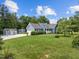 Lovely single-Gathering home, showcasing a well-maintained lawn, a shed, and beautiful landscaping at 304 Foxcroft Dr, Timberlake, NC 27583