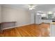Spacious living room with wood floors, a refrigerator, and a kitchen view at 304 Foxcroft Dr, Timberlake, NC 27583