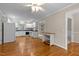 Spacious living room with wood floors and open view of kitchen at 304 Foxcroft Dr, Timberlake, NC 27583