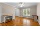 Bright living room with wood floors and view of entry way at 304 Foxcroft Dr, Timberlake, NC 27583