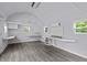 Spacious outbuilding featuring vinyl plank flooring, mini-split and windows for natural light at 304 Foxcroft Dr, Timberlake, NC 27583