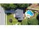 An aerial view of the home shows a spacious backyard featuring a swimming pool and meticulous landscaping at 308 Wescott Ridge Dr, Holly Springs, NC 27540