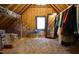 This attic is carpeted and features a mirror, a window and lots of storage at 308 Wescott Ridge Dr, Holly Springs, NC 27540