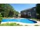 Large backyard with a private pool, deck, and bar perfect for outdoor entertaining and relaxation at 308 Wescott Ridge Dr, Holly Springs, NC 27540