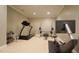 This workout area features a treadmill, a squat rack, and Hydrow rower at 308 Wescott Ridge Dr, Holly Springs, NC 27540