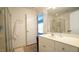 This bright bathroom includes a shower stall, a white vanity, and wainscoting at 308 Wescott Ridge Dr, Holly Springs, NC 27540