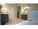 Well-lit bathroom with a soaking tub, dual vanities, and neutral finishes at 308 Wescott Ridge Dr, Holly Springs, NC 27540
