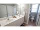 Bright bathroom boasts a double sink vanity, large mirror, and a separate toilet and shower area at 308 Wescott Ridge Dr, Holly Springs, NC 27540