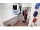 This walk-in closet is stocked with clothes, hats, and a laundry basket at 308 Wescott Ridge Dr, Holly Springs, NC 27540