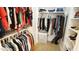 Walk-in closet features ample shelving and hanging space at 308 Wescott Ridge Dr, Holly Springs, NC 27540