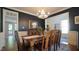 Charming dining room with a large table, ample seating, and view into the brightly lit living areas at 308 Wescott Ridge Dr, Holly Springs, NC 27540