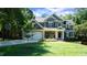 Charming two-story home with a well-manicured lawn, stone accents, and a two-car garage, exuding curb appeal at 308 Wescott Ridge Dr, Holly Springs, NC 27540