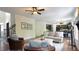 Bright living room with hardwood floors, neutral decor, and an open layout at 308 Wescott Ridge Dr, Holly Springs, NC 27540