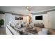 Inviting living room with neutral tones, modern furniture, and a large TV for entertainment at 308 Wescott Ridge Dr, Holly Springs, NC 27540