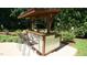 An outdoor bar and seating area provide a perfect setting for entertaining guests by the pool at 308 Wescott Ridge Dr, Holly Springs, NC 27540