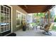 Covered patio with comfortable seating area, offering a relaxing outdoor living space at 308 Wescott Ridge Dr, Holly Springs, NC 27540