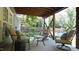 Inviting covered patio with seating, perfect for outdoor relaxation and entertainment with backyard view at 308 Wescott Ridge Dr, Holly Springs, NC 27540