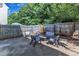 Enjoy this backyard featuring a small grassy area, mulch beds, and a seating area at 3119 Guiding Light Rd, Raleigh, NC 27610