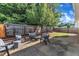 Enjoy this backyard featuring a small grassy area, mulch beds, and a seating area at 3119 Guiding Light Rd, Raleigh, NC 27610