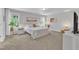 Bright bedroom with neutral tones, large windows and natural light, creating a relaxing atmosphere at 3119 Guiding Light Rd, Raleigh, NC 27610