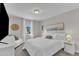 Bedroom with neutral walls and plush carpet features queen bed and accent pieces at 3119 Guiding Light Rd, Raleigh, NC 27610