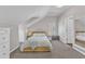 Bright bedroom with neutral walls and carpeted floors, featuring a bed and storage at 3119 Guiding Light Rd, Raleigh, NC 27610